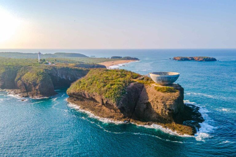 Aerial view of the cliffs and an island off Careyes, Costalegre