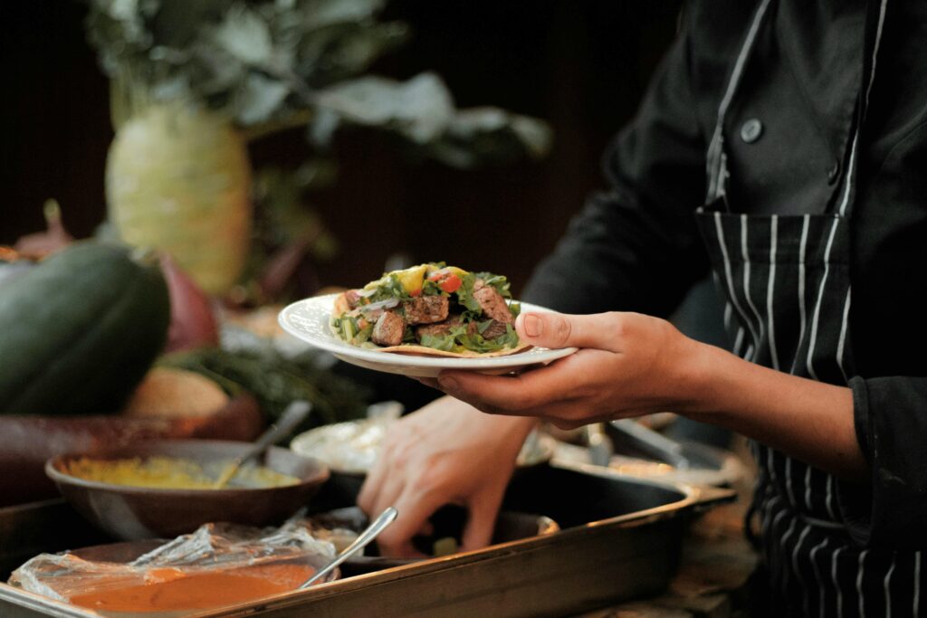 Chef finishing a plate in the kitchen