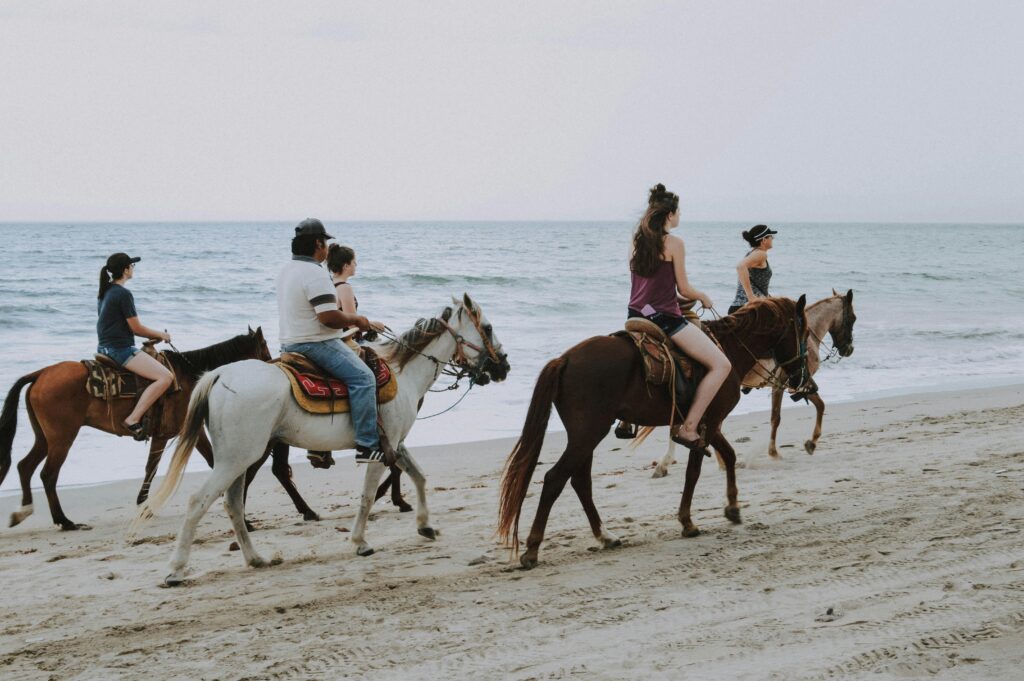 Horseback riding on the beach in Costalegre