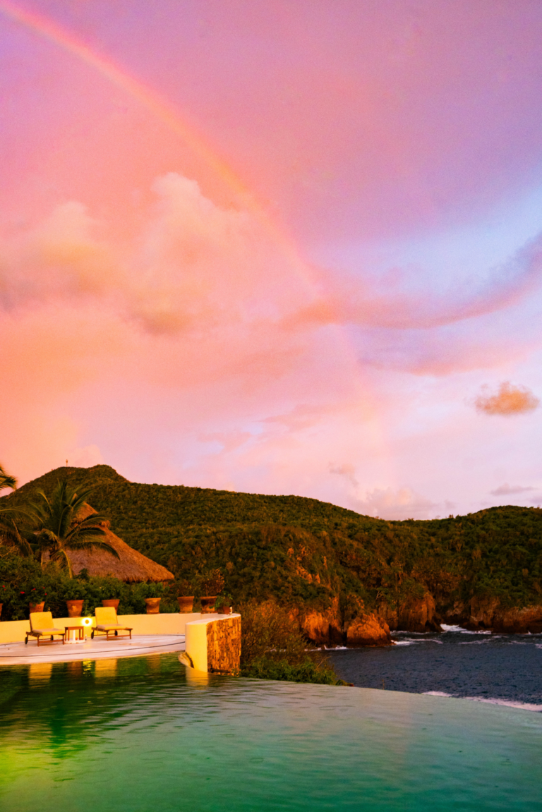 Pink sunset sky over the sierra behind Chamela Bay
