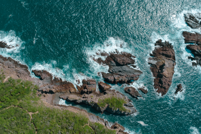 Aerial view of the rocky Costalegre shoreline below the villa