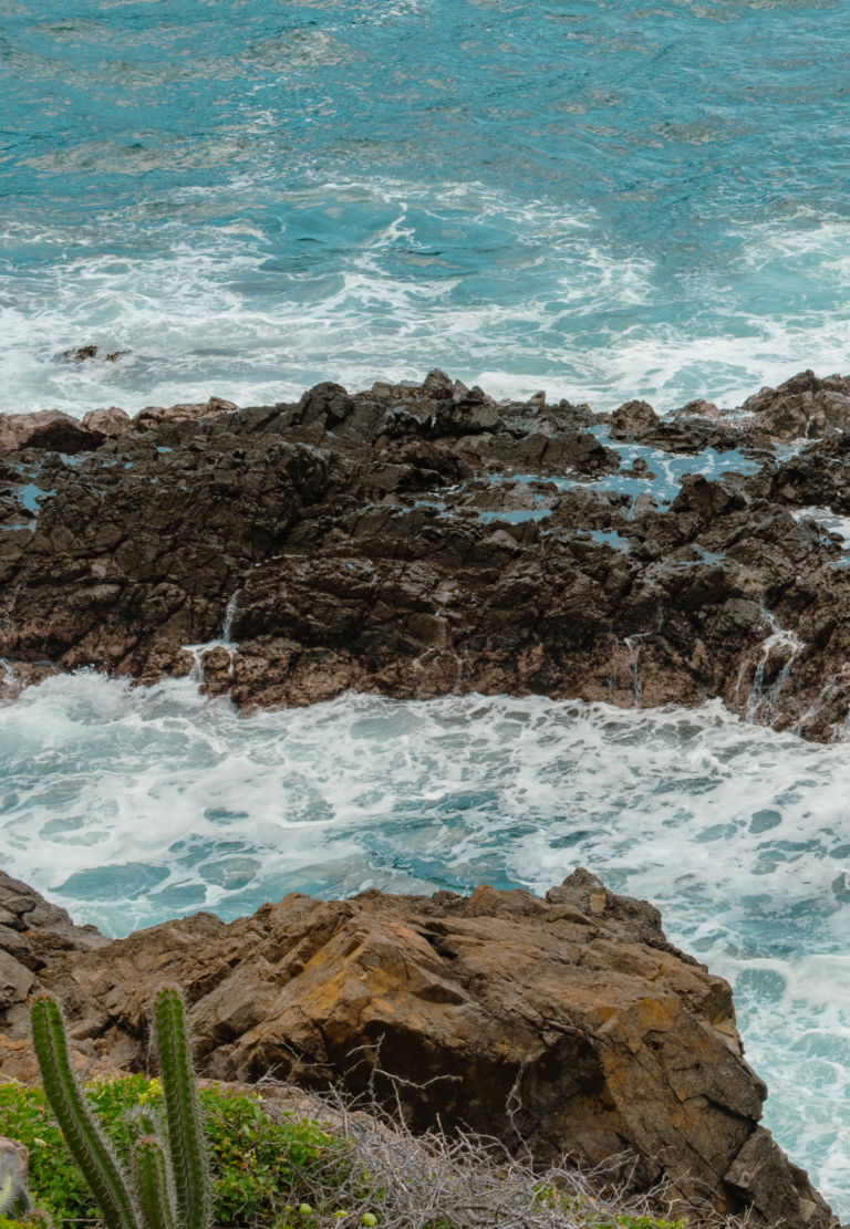 Pacific waves breaking on the volcanic rocks below Casa Papelillo