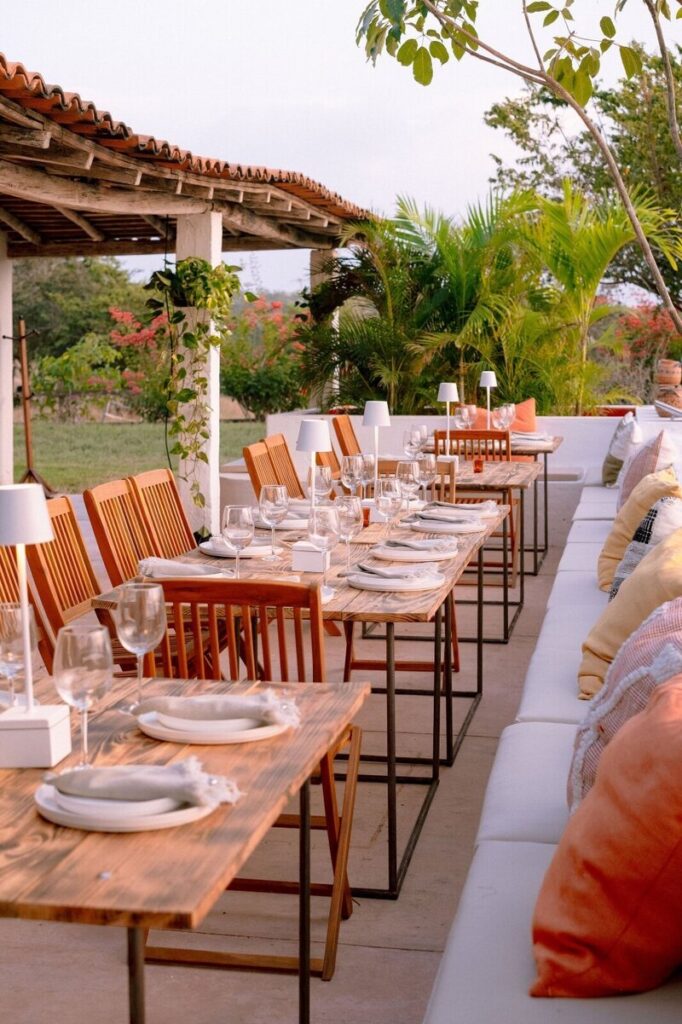 Long table set on a terrace at Malabar, Careyes