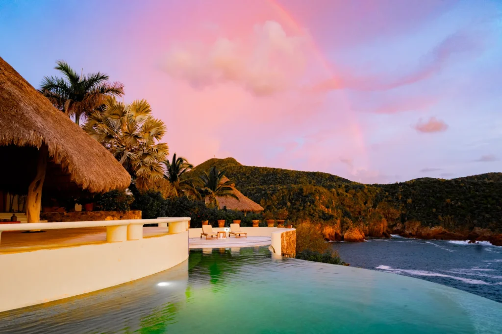 Terrace and palapa at Casa Papelillo above Chamela Bay at sunset
