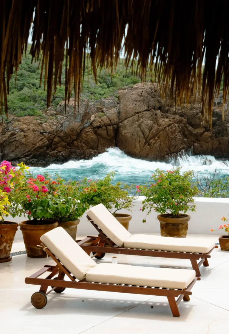 Sun loungers and bougainvillea on the terrace above Chamela Bay